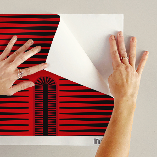 The artwork features a repeating geometric pattern of symmetrical shapes resembling elongated, curved diamonds or petals in various shades of blue and green. Each shape is split vertically with one half filled with a light blue and the other half filled with green or darker blue. The background is a light, almost pastel blue, which provides a soft yet vibrant backdrop. One of the blue shapes near the upper left contains a white starburst element, adding a focal point of brightness to the composition. The overall design conveys a modern, mid-century aesthetic with clean lines and harmonious color contrasts.